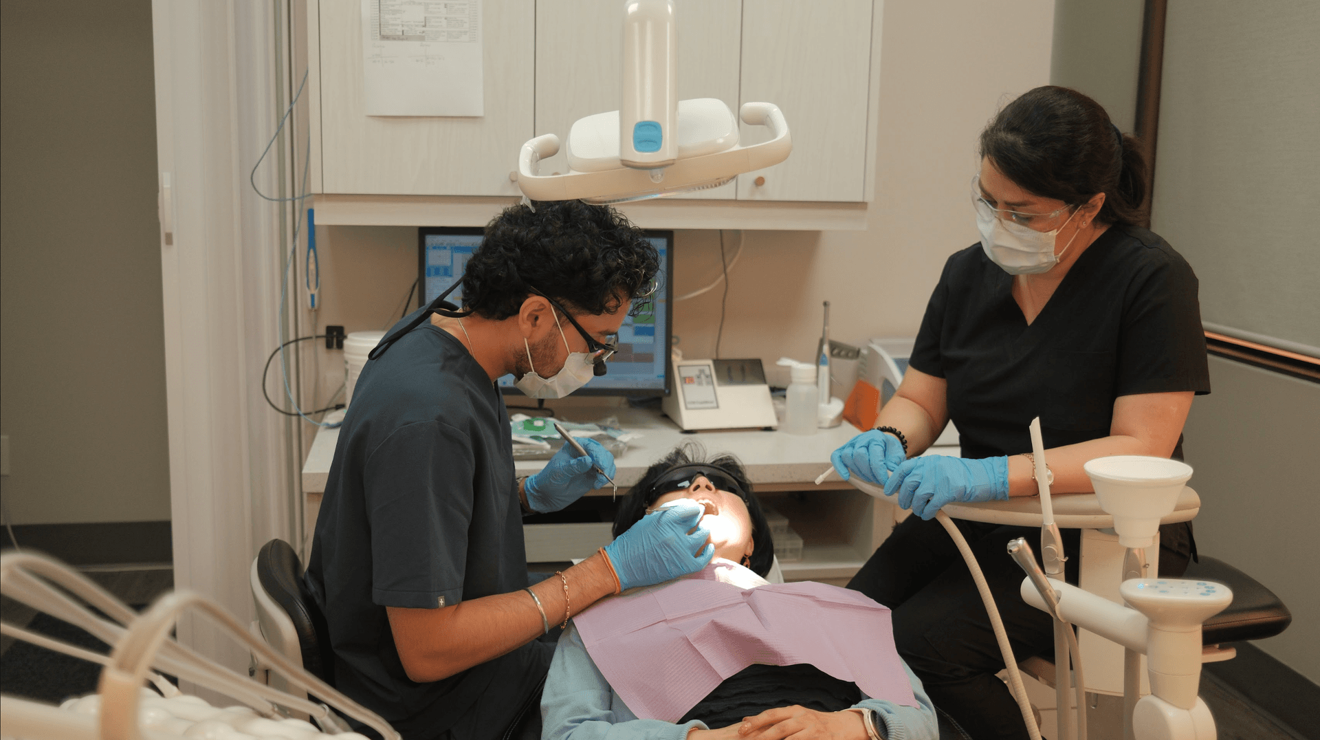 Dr. Ronit Sharma treating a patient chairside