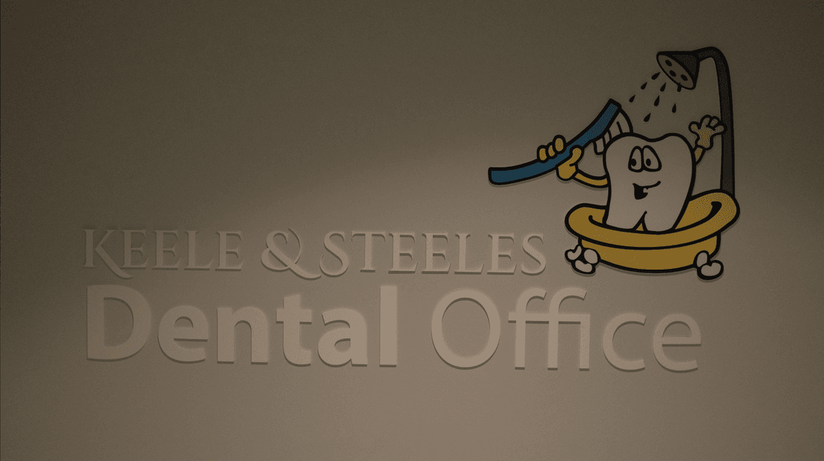 Keele & Steeles Dental Office wall sign with tooth mascot